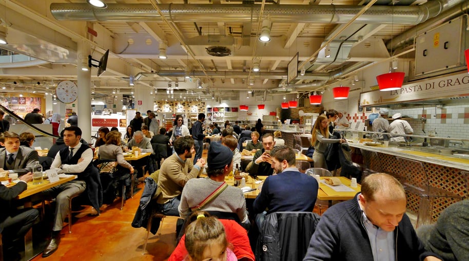 Diverse People Eating in a Food Court